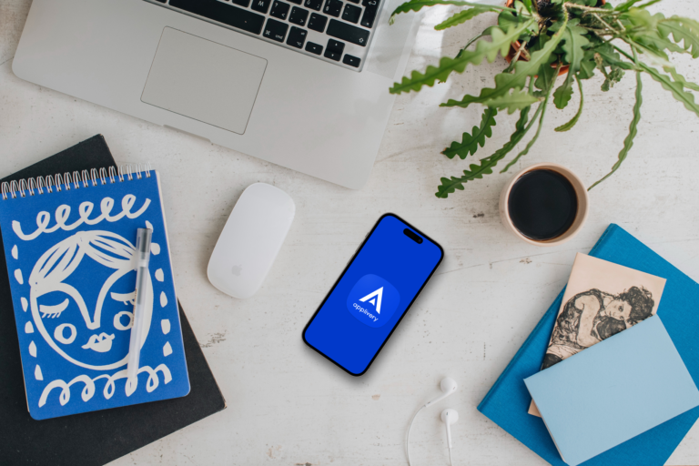 Mockup of smartphone device with a MacBook on the side Mockuuups Studio | Applivery Applivery