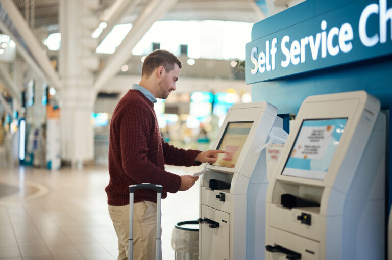 man-airport-and-self-service-kiosk-for-check-in-2023-11-27-05-09-53-utc | Applivery